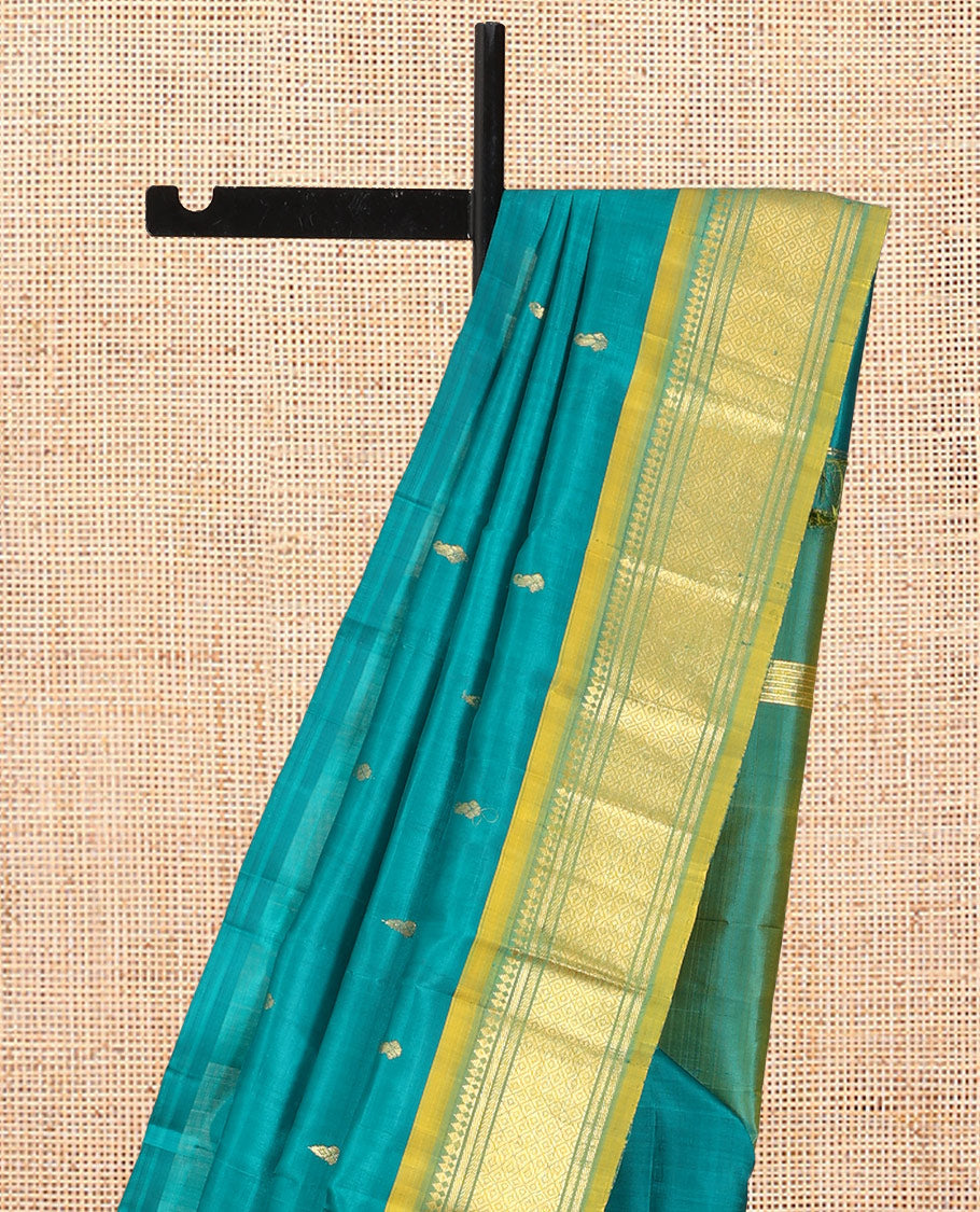 Green Kanchipuram Silk Saree, Adorned with Zari Buttas, Complemented by a Contrast Border of Panner Sombu, Banaras, and Mayil Kann Design, Pallu of Zari Design, and No Blouse