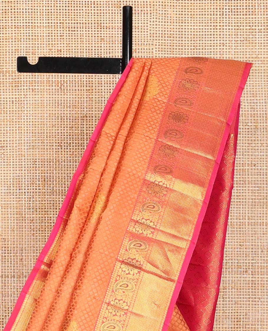 Orange  floral design silk saree with contrast border of thilakam mokku, paun, manga design & argyle design pallu