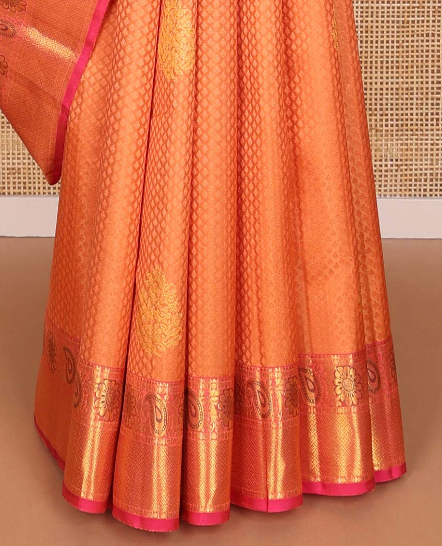 Orange  floral design silk saree with contrast border of thilakam mokku, paun, manga design & argyle design pallu