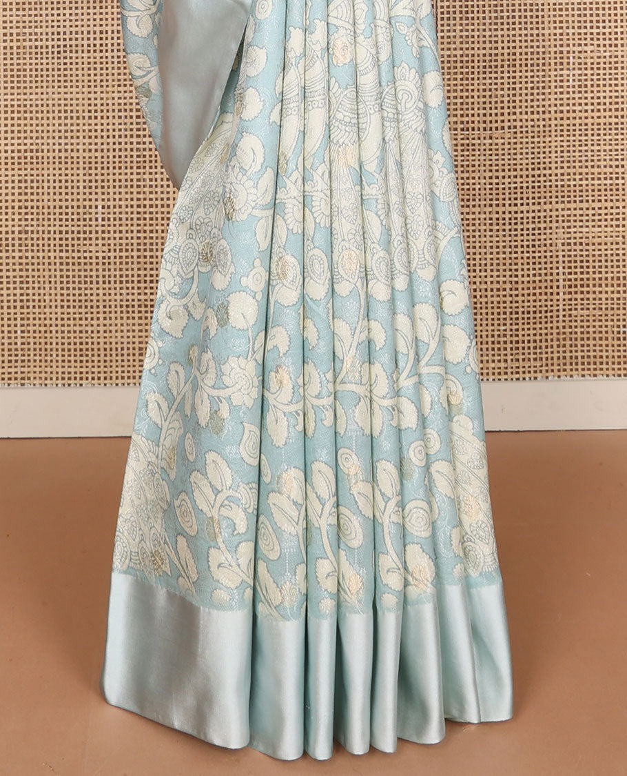 Blue kalamkari-style floral vine & peacock printed tussar saree with zari buttas, plain border & plain pallu