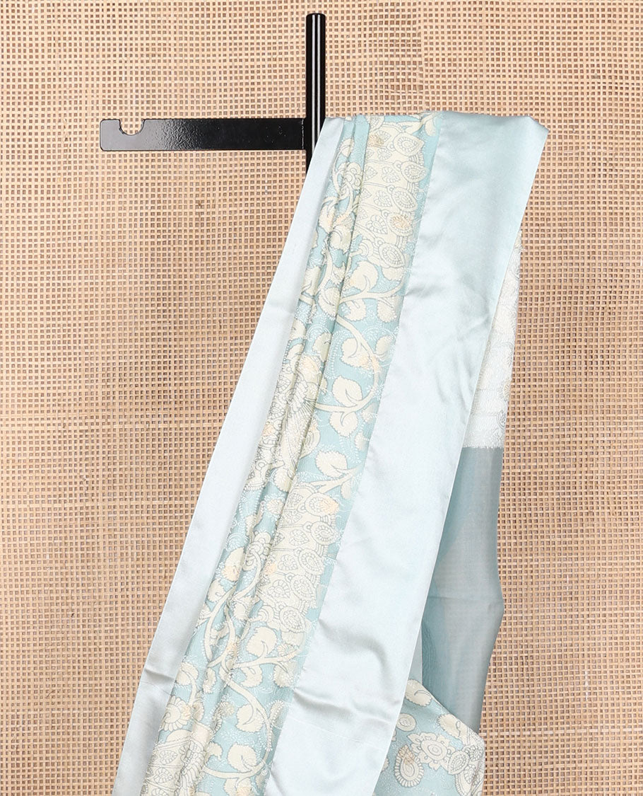 Blue kalamkari-style floral vine & peacock printed tussar saree with zari buttas, plain border & plain pallu