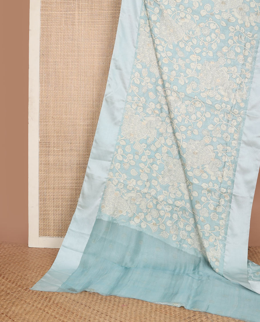 Blue kalamkari-style floral vine & peacock printed tussar saree with zari buttas, plain border & plain pallu