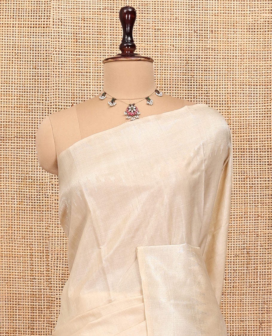 Cream Plain Tussar Silk Saree, a Gleaming Temple Zari Border, a Striped Pallu, and a Matching Blouse