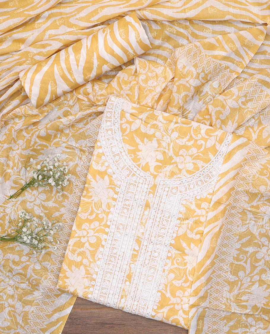Yellow cotton material churidar set, floral printed with neck embroidered top, tiger skin style printed bottom, and dupatta of floral and animal print