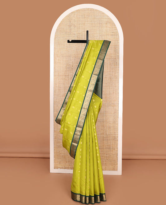 Green Vasundhara Lite-Silk Mix Saree Subtly Sparked with Zari Buttas, Complemented by a Contrast Border of Muthu, Rudraksham, and Mayil Designs, Pallu Elevated with Intricate Designs, and Paired with a Contrast Blouse