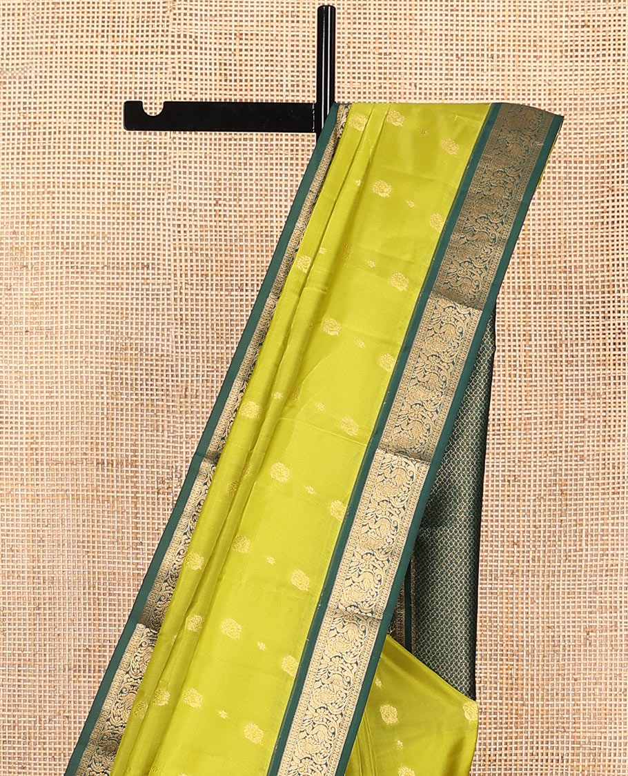 Green Vasundhara Lite-Silk Mix Saree Subtly Sparked with Zari Buttas, Complemented by a Contrast Border of Muthu, Rudraksham, and Mayil Designs, Pallu Elevated with Intricate Designs, and Paired with a Contrast Blouse