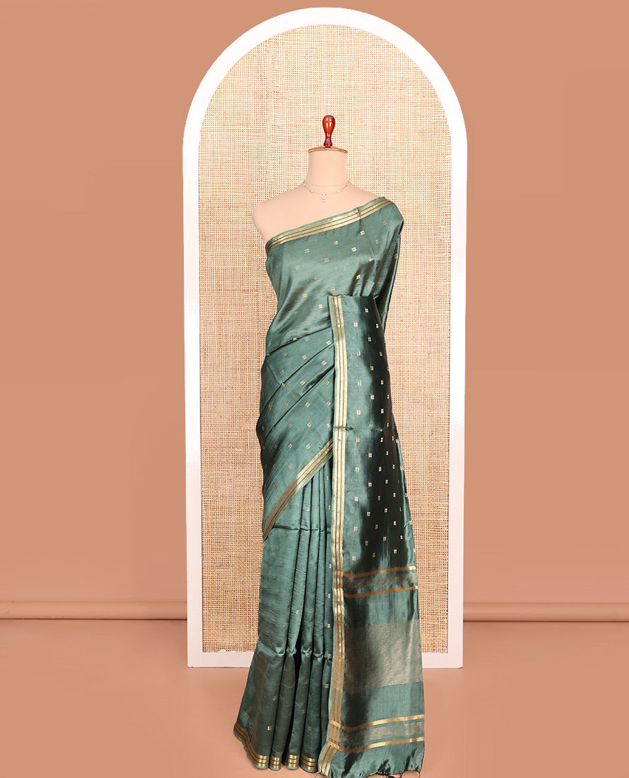 Green Banana Pith Saree Prettified with Square-Shaped Zari Buttas, Subtly Woven Zari Piping Border, Pallu Gleamed Up with Zari Stripes, and Paired with a Matching Blouse