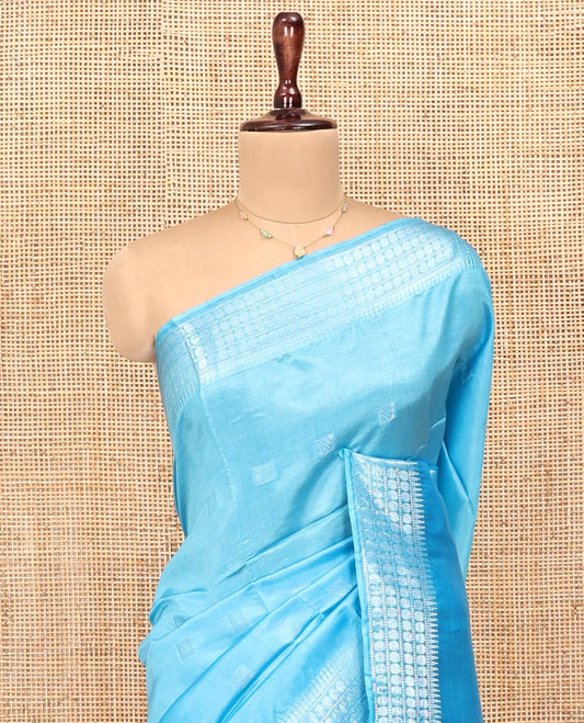 Blue Banana Pith Saree, Subtly Sparkled with Square Buttas All Over Its Body, Sparsely Woven Temple Border of Rudraksham Designs, Pallu of Buttas, and Paired with a Matching Blouse
