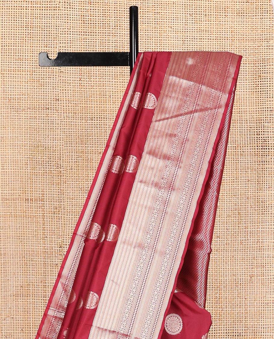 Maroon iruthalai pakshi and chakram Vasundhara silk mix, traditional motifs zari woven border, and vanki pallu