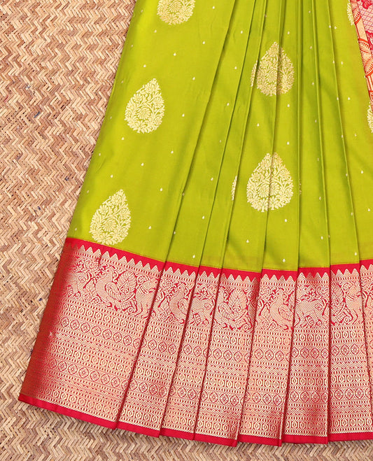 Green Budget Silk Saree, Subtly Adorned with Zari Buttas on Its Body, Complemented by a Contrast Traditional Zari Design Border, Pallu of Paisleys, and Paired with a Contrast Blouse