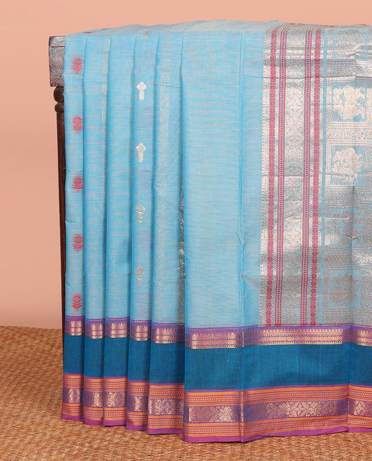 Blue Chettinad Cotton Saree Adorned with Floral Thread Buttas All Over Its Body, Complemented by Contrast Rettai Pettu Border of Traditional Designs, Pallu of Peacock and Yaali Butta Enclosed Checks, and Paired with a Matching Blouse