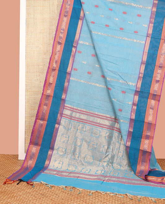 Blue Chettinad Cotton Saree Adorned with Floral Thread Buttas All Over Its Body, Complemented by Contrast Rettai Pettu Border of Traditional Designs, Pallu of Peacock and Yaali Butta Enclosed Checks, and Paired with a Matching Blouse