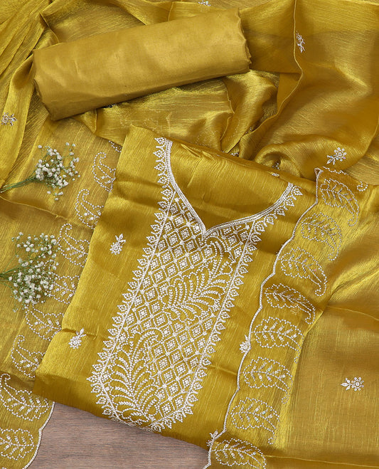 Green material chudidar set, thread embroidered top, plain bottom, and thread embroidered scallop dupatta