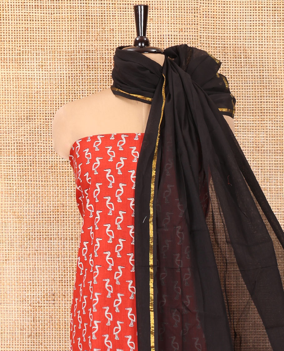 Red Handloom Cotton Material Chudidar Set, Subtly Adorned with Bird Motifs All Over Its Body, Complemented by Contrast Plain Bottom, and Paired with a Contrast Dupatta