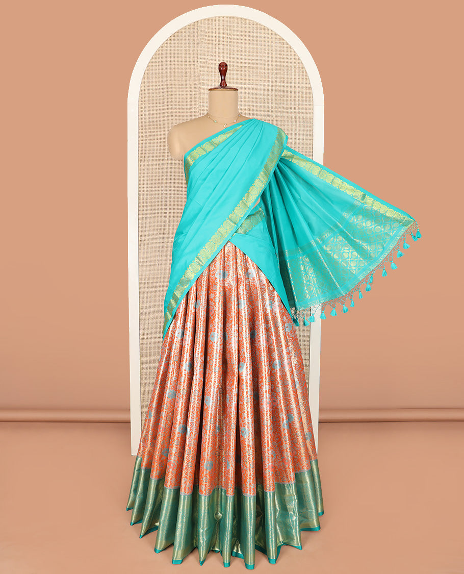 Light Orange Art Silk Material Half Saree Set Featuring Jacquard Skirt, a Contrast Traditional Zari Design Border, a Zari-Jacquard Blouse, and a Dhavani Decked with Zari Designs