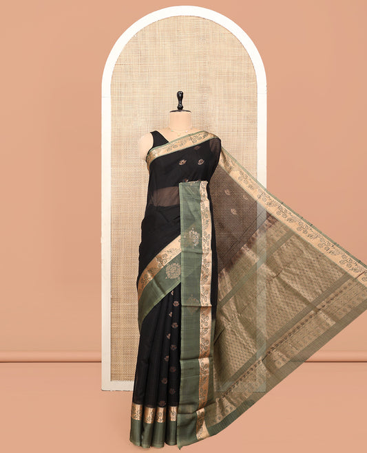 Black Silk Cotton Saree, Adorned with Zari Buttas, Complemented by a Contrast Floral-Peacock Zari Border, Grand Jaal Pallu, and a Contrast Blouse