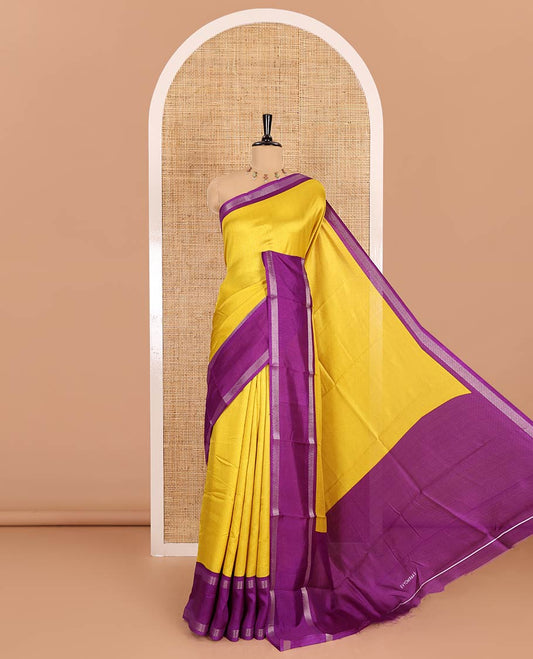 Yellow embossed moss chiffon saree, contrast traditional rettai pettu border, embossed pallu, and a contrast embossed blouse