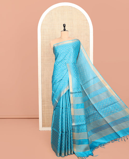 Blue Tussar Silk Saree, Subtly Sparkled with Buttas, a Subtle Temple Border, Pallu Features Stripes and Buttas, and a Matching Blouse