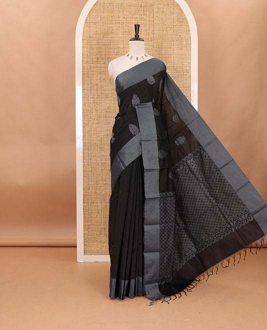 Black butta silk cotton , contrast bawanchi border & thread weaving rich pallu with tussels