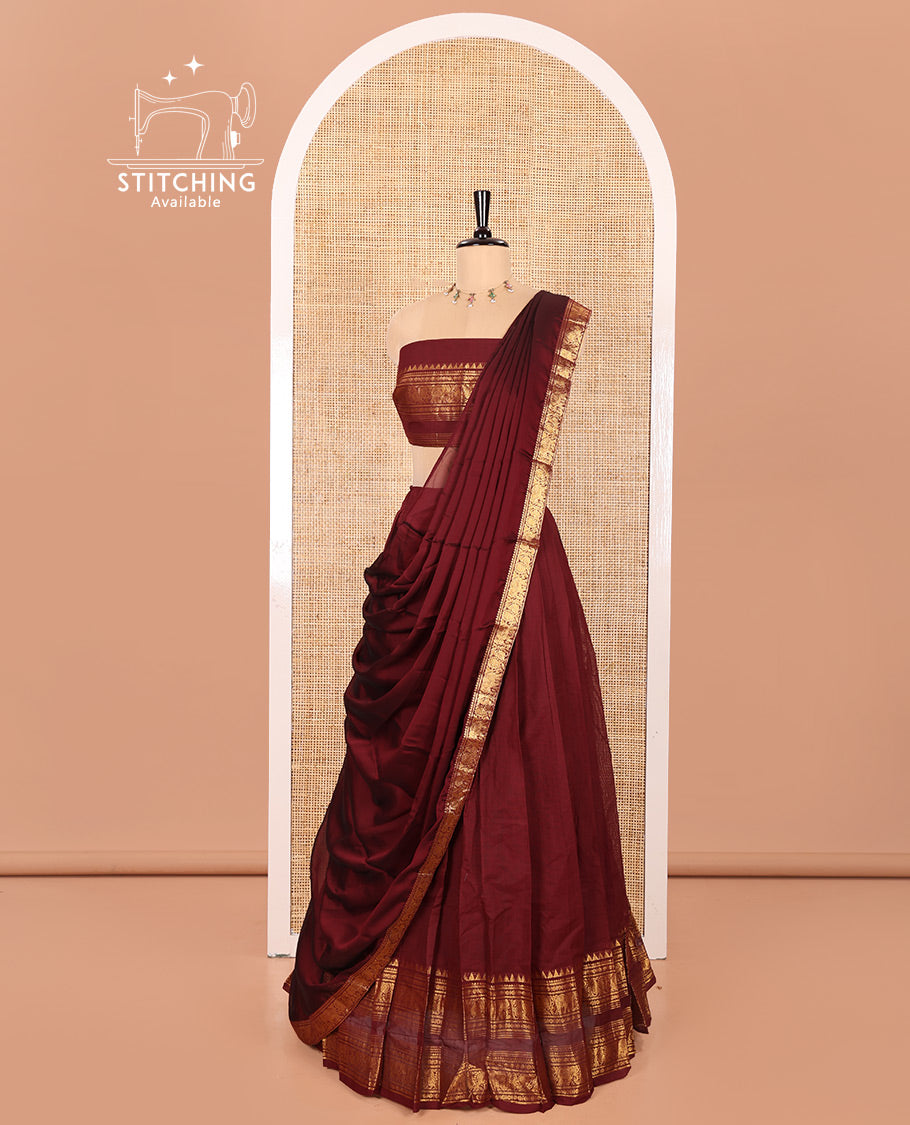 Maroon Chettinad Cotton Half-Saree Featuring Plain Skirt, Elevated with a Contrast Traditional Zari Design Varisai Pettu Border, Paired with a Matching Blouse, and a Satin Georgette Zari Bordered Dhavani