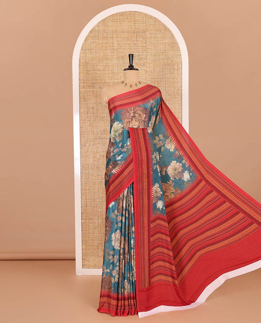 Teal blue floral printed Italian crepe saree, contrast temple printed border, striped pallu, and a printed bordered blouse
