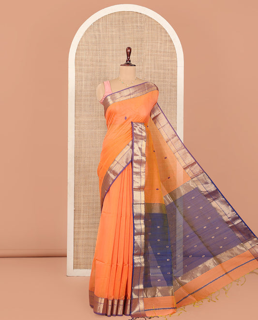 Orange Maheshwari Cotton Saree, Delicately Woven with Thread Buttas All Over Its Body, Complemented by Contrast Traditional Zari Design Border, Pallu Steeped with Zari Buttas, and Paired with a Contrast Blouse
