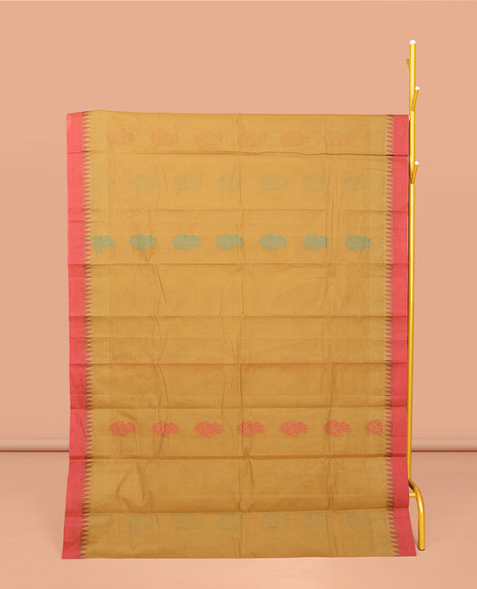 Mustard Kanchi Cotton Saree, Ornamented with Buttas All Over Its Body, Complemented by a Contrast Temple Border, Pallu of Floral Design, and Paired with a Matching Blouse