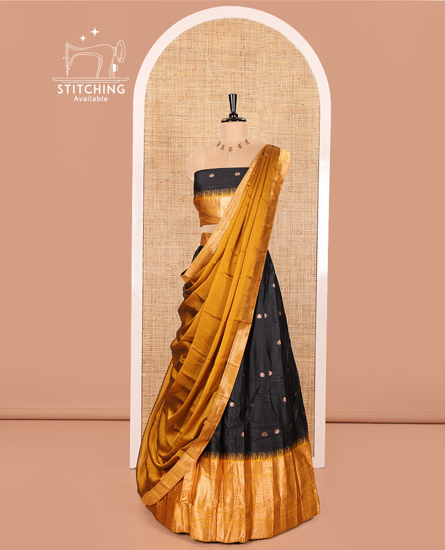 Black and Mustard Semi-Banaras Half-Saree Featuring Zari Buttas All Over the Skirt, Accentuated with a Contrast Traditional Zari Design Border, Paired with a Matching Blouse, and Has a Plain Syska Georgette Dhavani with a 4-Sided Zari Border