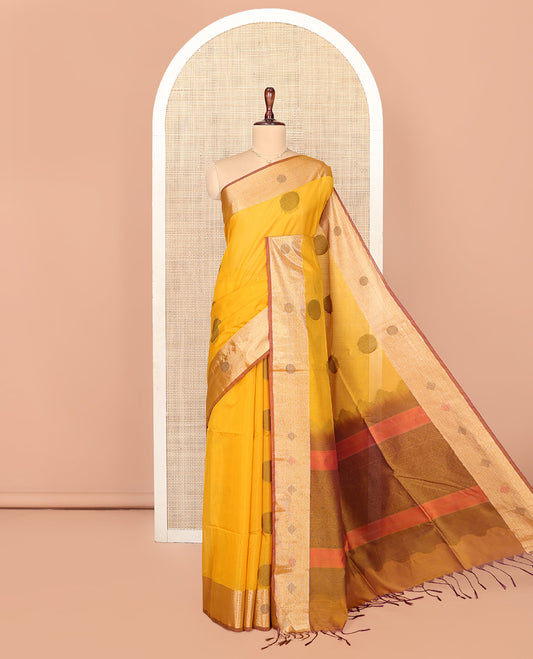 Mustard Silk Cotton Saree, Spotlighted with Round Buttas All Over Its Body, Complemented by Contrast Border, Sparsely Woven Pallu, and Paired with a Contrast Blouse