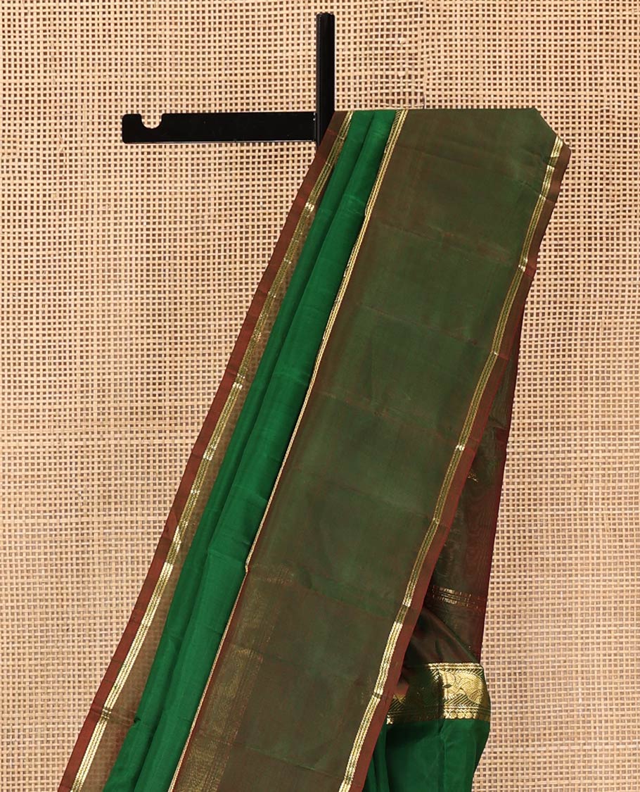 Green Plain Kanchipuram Silk Saree, Complemented by a Contrast Rettai Pettu Border of Manga, Neli, Banaras, and Meen Designs, Pallu of Zari Designs, and Paired with a Contrast Blouse