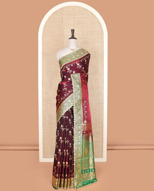 Maroon floral buttas banarasi silk saree, contrast floral creeper stone work lace border, and pallu of intricate designs and stone work