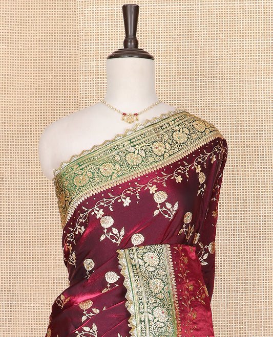 Maroon floral buttas banarasi silk saree, contrast floral creeper stone work lace border, and pallu of intricate designs and stone work