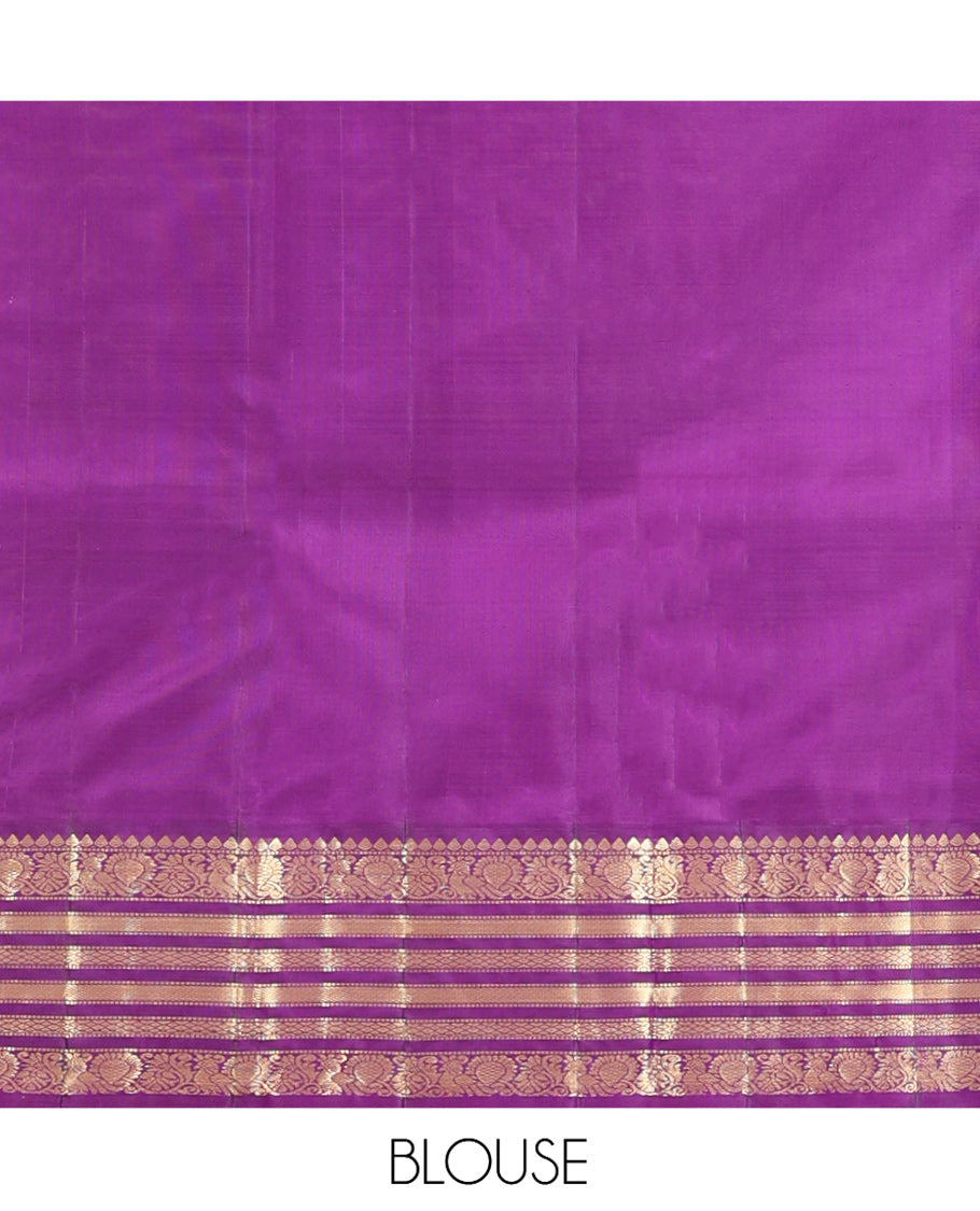 Yellow Vasundhara Silk Saree, Sparsely Woven with Zari Buttas All Over Its Body, Complemented by a Contrast Border of Thilakam, Muthu, Mayil, and Mayil Kann Designs, Pallu of Zari Designs, and Paired with a Contrast Blouse