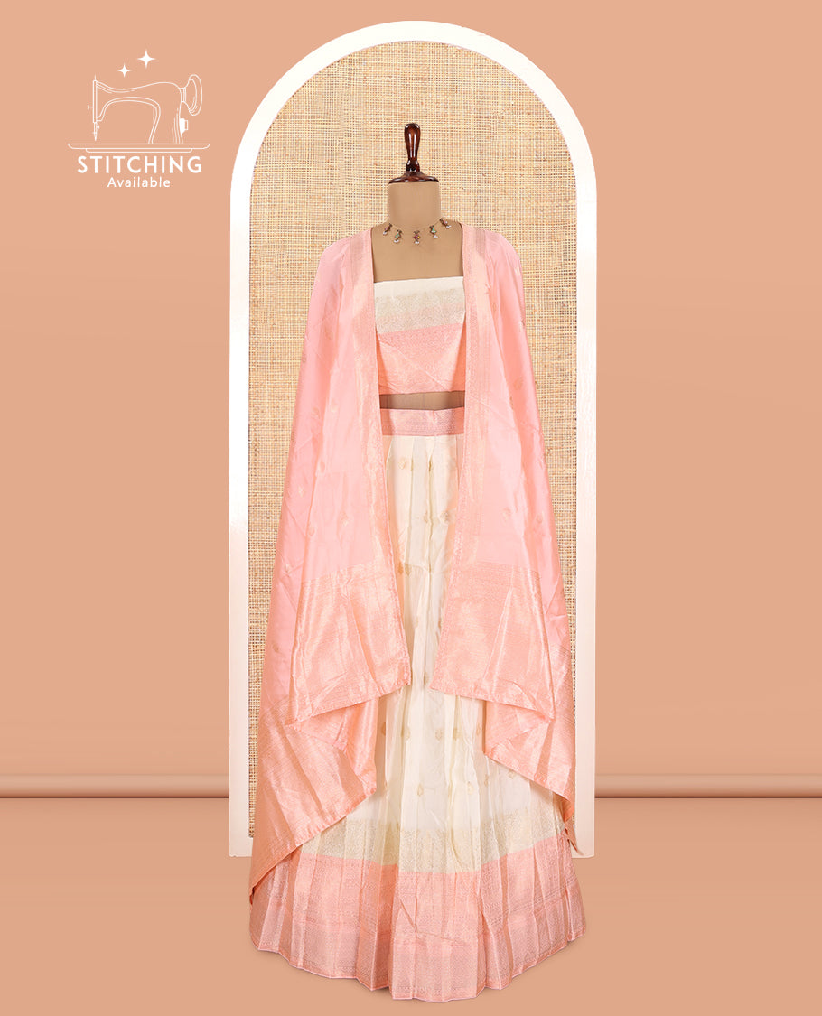 Cream-Peach Semi-Silk Half-Saree, Subtly Sparkled with Zari Buttas Skirt, a Contrast Traditional Zari Border, and a Contrast Dhavani