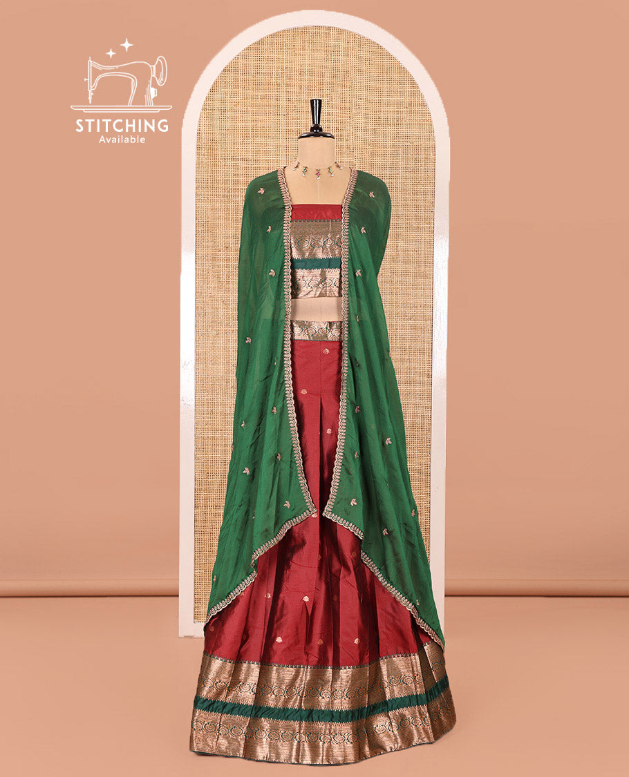 Maroon and Green Semi-Banarasi Half-Saree Featuring Zari Buttas Skirt, Complemented by Contrast Rettai Pettu, Traditional Border of Floral Creeper Designs, Paired with a Matching Blouse, and a Satin Georgette Embroidered Scallop Dhavani