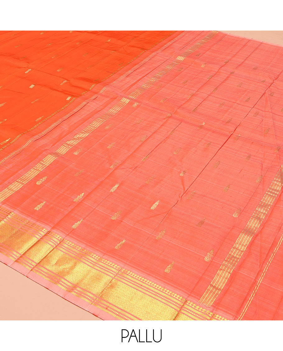 Orange Kanchipuram Silk Saree, Mesmerized with Zari Buttas on Its Body, Complemented by a Contrast One-Sided Border of Paneer Sombu, Banaras, Muthu and Mayil Kann Designs, Pallu of Zari Designs, and Comes Without a Blouse