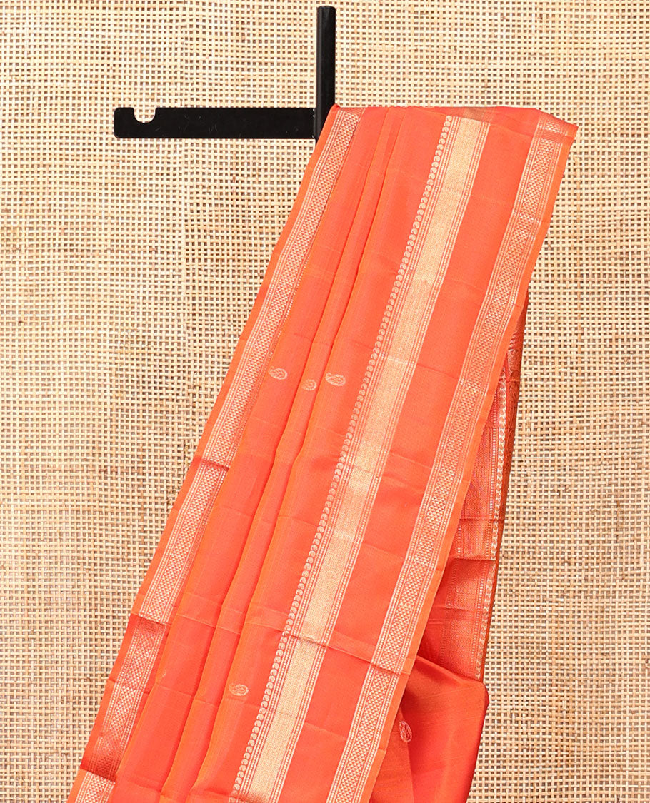 Orange Kanchipuram Silk Saree, Ornamented with Manga Buttas, Highlighted By Zari Rettai Pettu Border of Manga, Banaras, Mayil Kann, and Arai Maadam Design, Grand Pallu, and a Matching Blouse