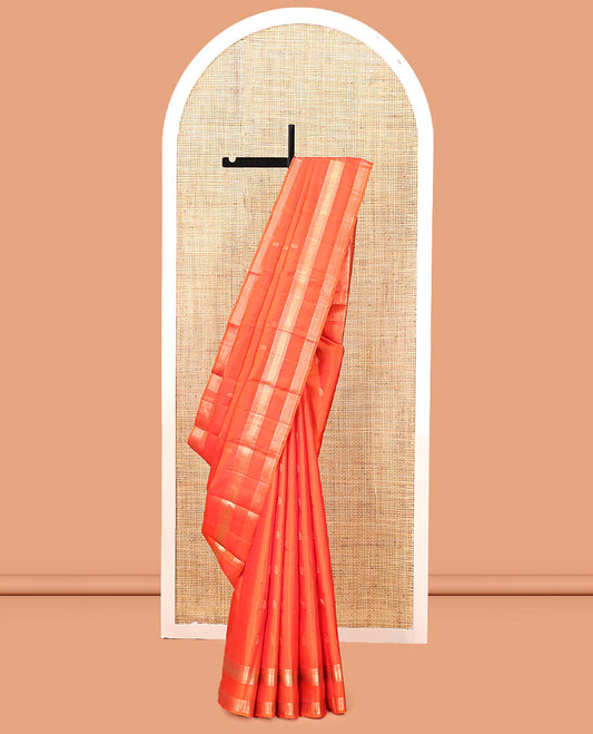 Orange Kanchipuram Silk Saree, Ornamented with Manga Buttas, Highlighted By Zari Rettai Pettu Border of Manga, Banaras, Mayil Kann, and Arai Maadam Design, Grand Pallu, and a Matching Blouse