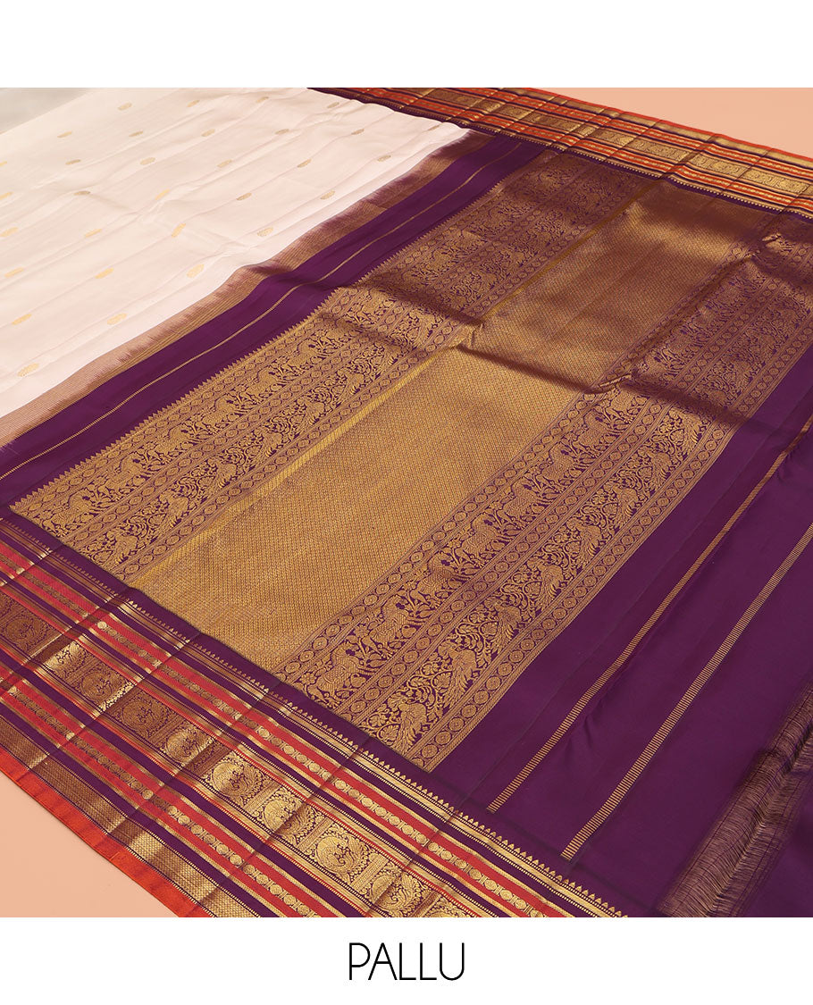 White Kanchipuram Silk Saree, Enthralled with Zari Buttas, a Contrast Korvai Border of Rekku, Muthu, Banaras, Poun, Mayil, Kathir, and Mayil Kann, Grand Pallu, and a Contrast Blouse