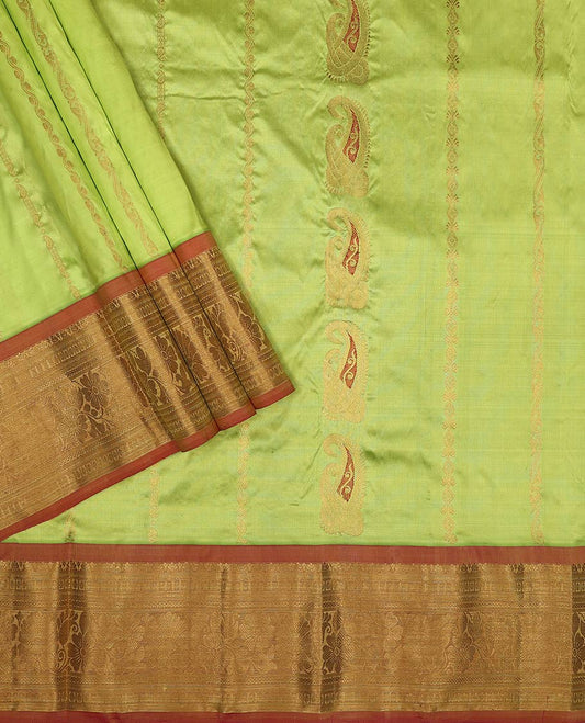 Light green floral design silk half saree with contrast border of banaras, muthu, paun design, zari design blouse & floral design dhavani