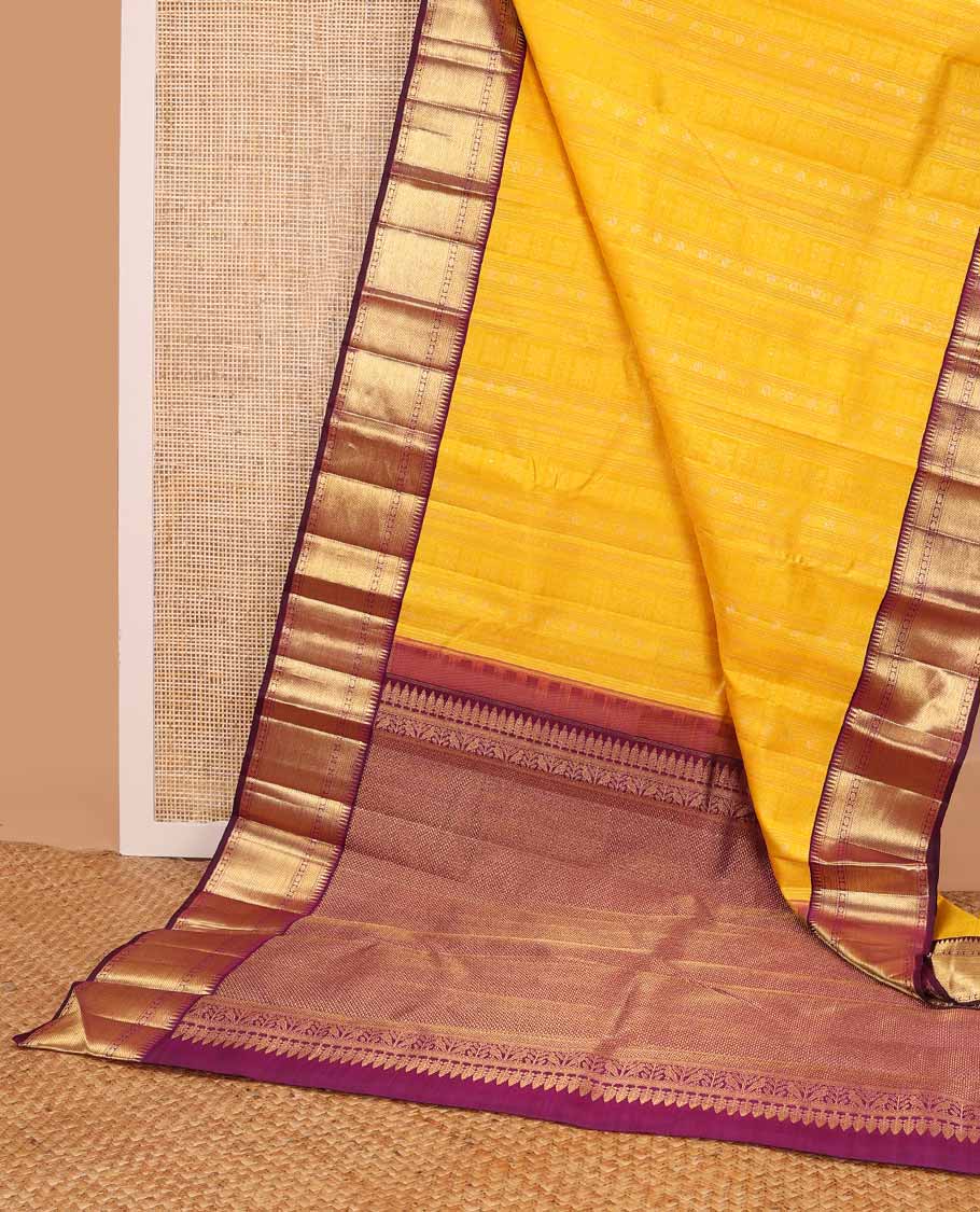 Yellow floral design silk saree with contrast border of rekku, paun, mayil kann design & jaal design pallu