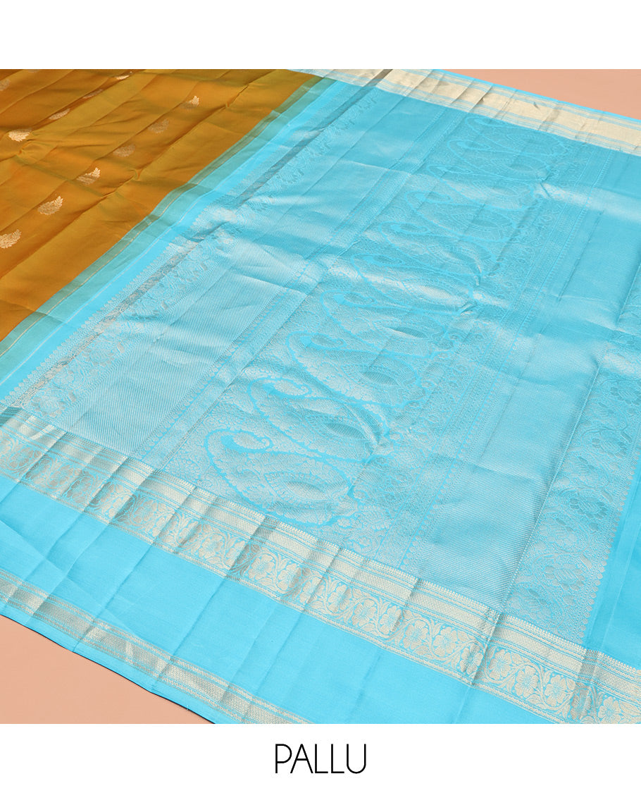 Mustard Vasundhara Silk Saree, Woven with Zari Buttas, Contrast Rettai Pettu Border of Thilakam Mokku, Neli, Mayil Kann, and Kodi Visiry Designs, Grand Pallu, and a Contrast Blouse