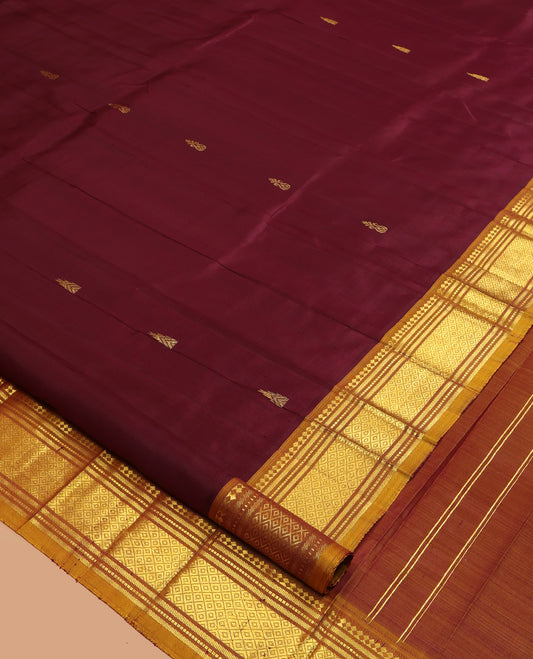 Maroon Kanchipuram Silk Saree, Accentuated with Zari Buttas, a Contrast One-Sided Border of Paneer Sombu, Rekku, Banaras, Muthu, and Mayil Kann Design, Zari Design Pallu, and No Blouse
