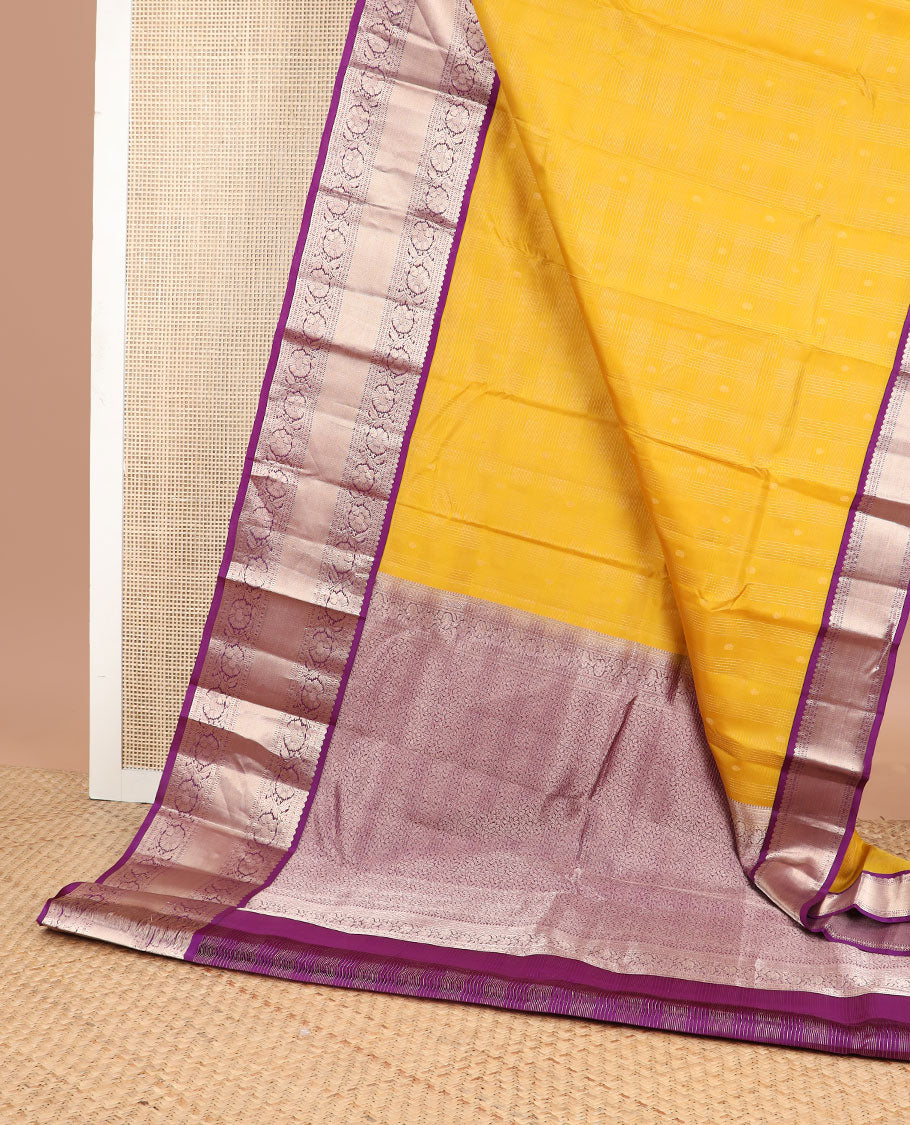 Yellow checked , buttas silk saree with contrast border of thilakam mokku, muthu, paun, kodi visiry design & zari design pallu
