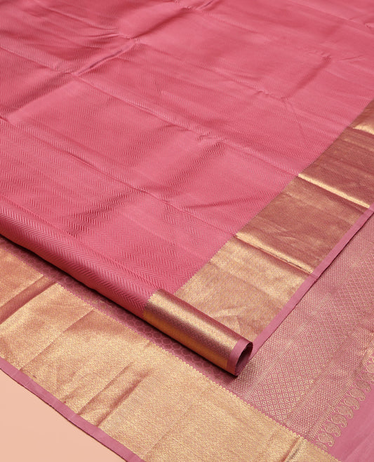 Pink Embossed Parampara Silk Saree, Highlighted by Zari Border of Thilakam and Vanki Designs, Pallu Steeped with Rudraksham Designs, and Paired with a Matching Blouse