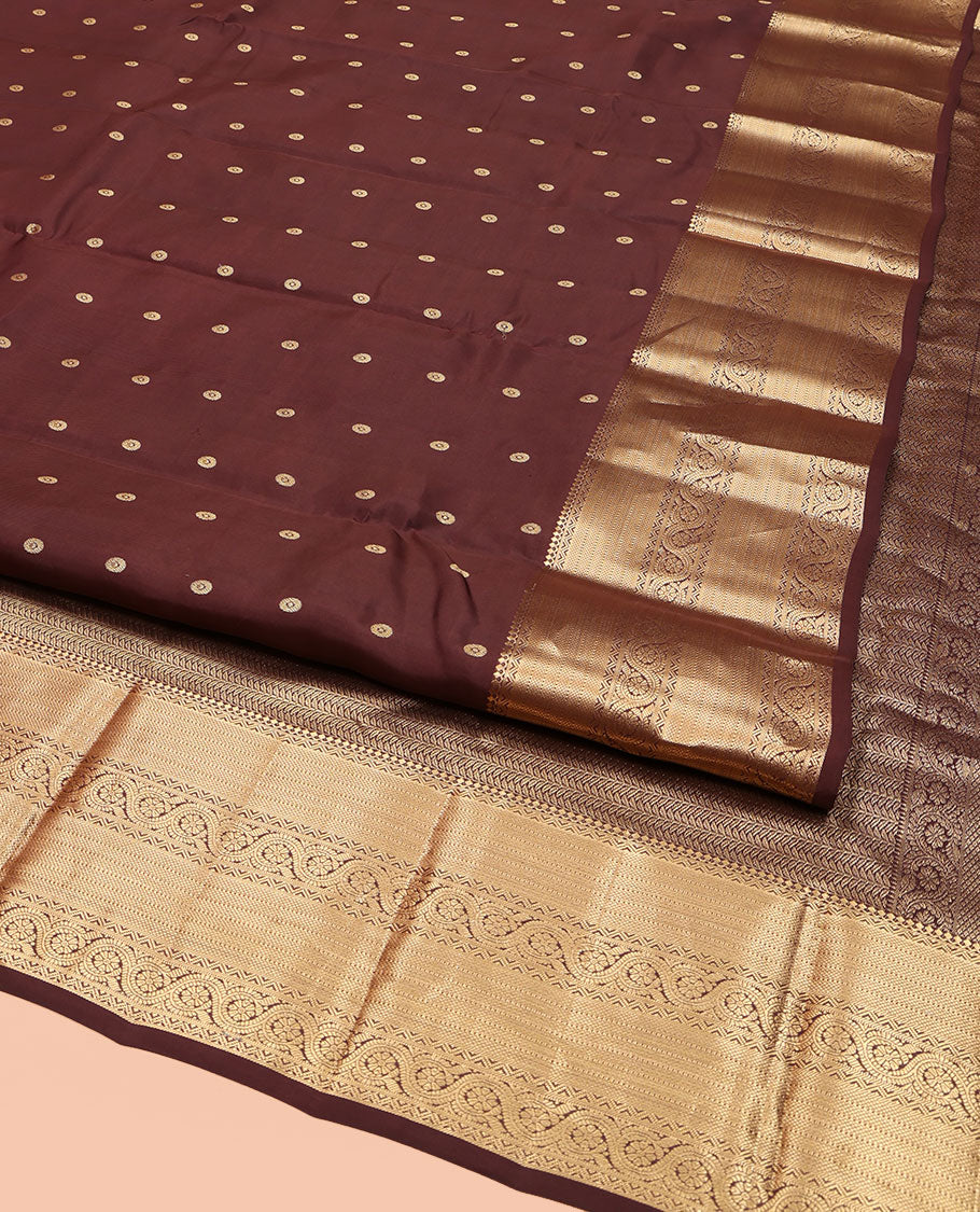 Brown Vasundhara Lite Silk Mix Saree, Decked Up with Zari Buttas All Over Its Body, Highlighted by a Zari Border of Salngai, Muthu, Dhavana Kodi, and Mayil Kann Designs, Pallu of Leaf Vine Designs, and Paired with a Matching Blouse