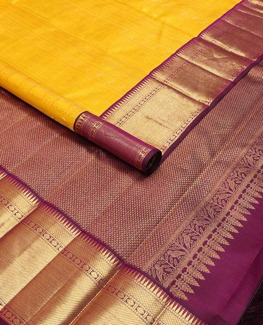 Yellow floral design silk saree with contrast border of rekku, paun, mayil kann design & jaal design pallu