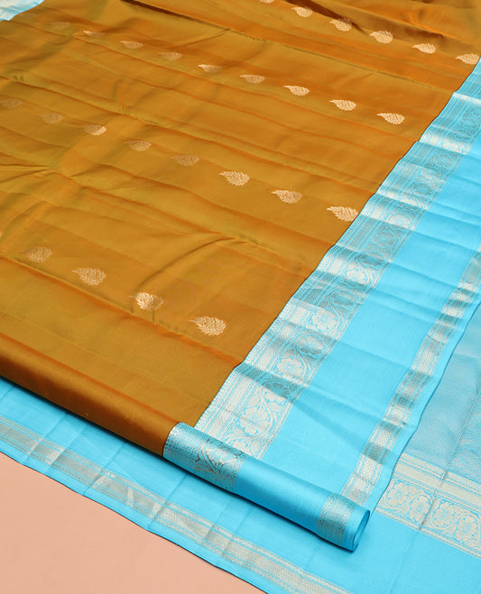 Mustard Vasundhara Silk Saree, Woven with Zari Buttas, Contrast Rettai Pettu Border of Thilakam Mokku, Neli, Mayil Kann, and Kodi Visiry Designs, Grand Pallu, and a Contrast Blouse