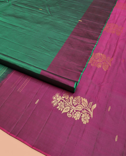 Green Kanchipuram Silk Saree Beautifully Sparkled with Zari Buttas, Complemented by a Contrast Border of Floral Zari Designs, Pallu Adorned with Floral Designs, and Paired with a Contrast Blouse