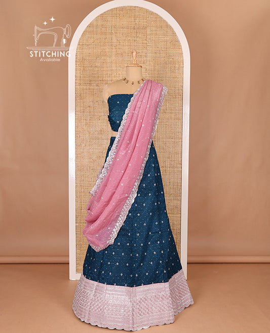 Blue half-saree, floral motifs embroidered semi raw silk top, matching embroidered blouse, and contrast scallop embroidered georgette dhavani